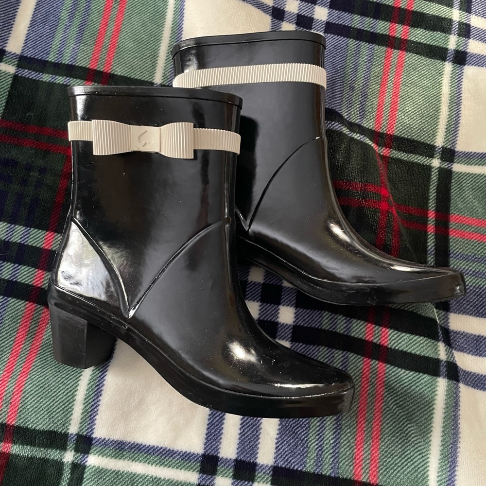 Heeled Kate Spade rain boots with white bows